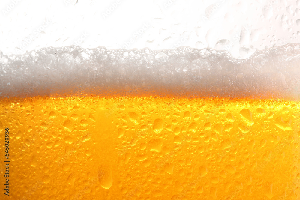 Glass of tasty cold beer with foam and condensation drops on white background, closeup Glass of tasty cold beer with foam and condensation drops on white background, closeup