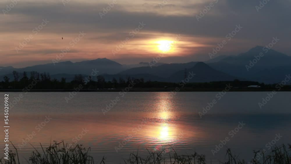 before sunset The light that falls on the water in the lake is very beautiful.