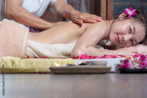 Professional masseur doing therapeutic massage. Woman enjoying massage Young woman getting relaxing body massage beauty spa center body care, skin care, wellness, wellness, beauty treatment concept