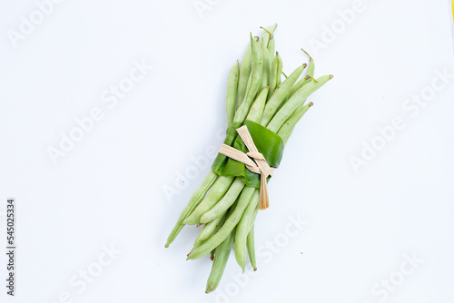 Green beans on white background.