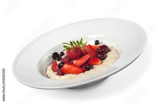 Close-up of tasty food with fruits in white plate isolated on white background