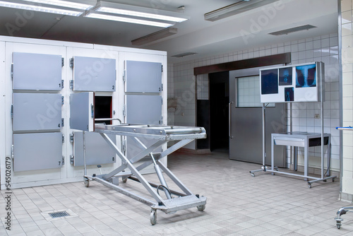 Grungy and high contrast photo of morgue trays photo