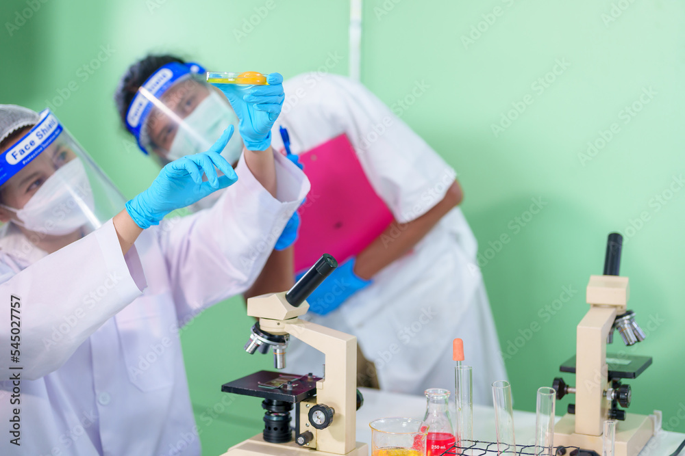 Modern Medical Research Laboratory: Stem cell researcher working in laboratory Study on Stem Cells on the Stereo microscope view in laboratory , Advanced Scientific Lab for Medicine, Biotechnology.