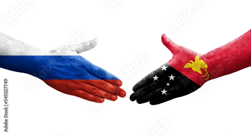 Handshake between Papua New Guinea and Russia flags painted on hands  isolated transparent image.
