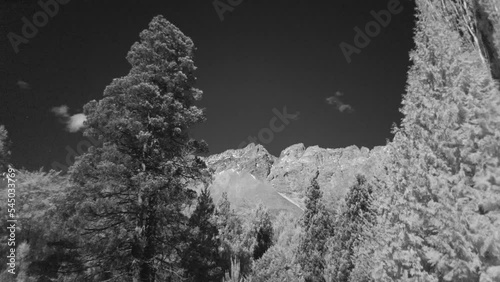 Infrared Landscape, Timelapse Of Clouds In The Mountains Of The Piltriquitron Hill, Patagonia, Framed By Tree, wide shoot photo