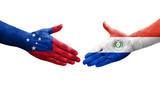 Handshake between Paraguay and Samoa flags painted on hands, isolated transparent image.