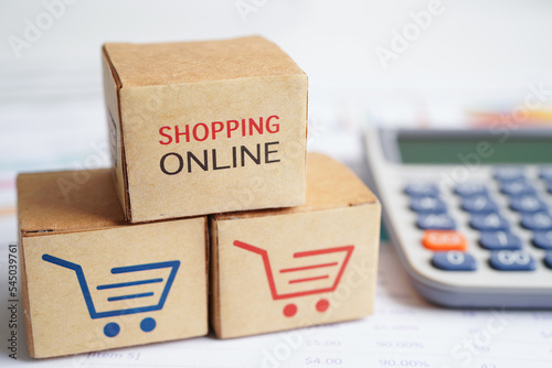 Online shopping, Shopping cart box on calculator, import export, finance commerce.