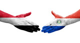 Handshake between Paraguay and Yemen flags painted on hands, isolated transparent image.