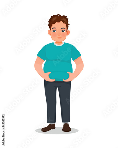 Overweight young man touching his fat belly hoping to lose weight