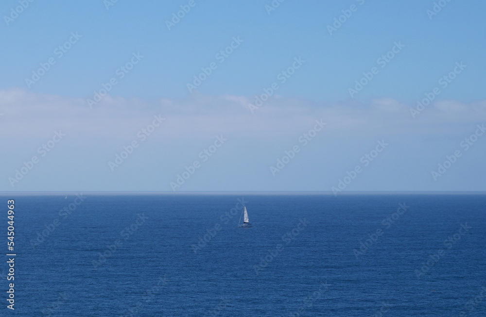 Lonesome Sailboat in the Pacific Ocean