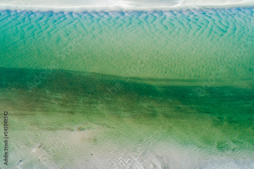Aerial view of sand ripples and patterns in a shallow creek. photo