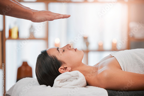 Spa, wellness and reiki massage of a woman sleeping for beauty, skincare and skin health therapist. Zen, salon facial and relax client detox, holistic and dermatology therapy feeling peace and calm photo
