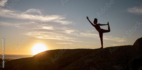 Woman, silhouette or yoga on sunset beach rocks in relax fitness, training and exercise for mental health, body mobility or wellness. Yogi, pilates or workout at sunrise for zen stretching by ocean