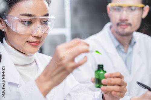 chemistry scientist working on biotechnology cosmetic research with natural herb medicine ingredient in biology science laboratory  organic bio eco beauty extract in botany experiment for dermatology