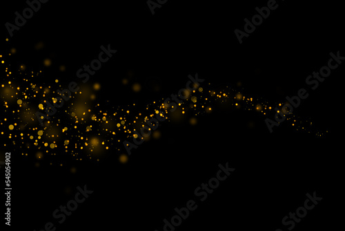 Gold glittering stars dust and bokeh background. Abstract christmas glow light texture.