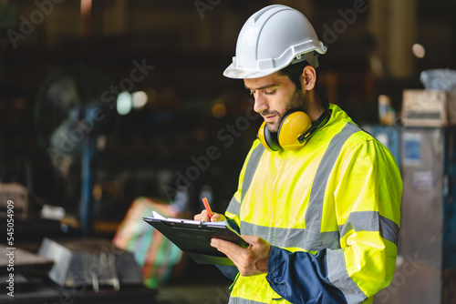 Wallpaper Mural professional technician engineer with safety hard hat working to maintenance construction equipment in industrial factory, inspection man having manufacturing occupation job of production technology Torontodigital.ca