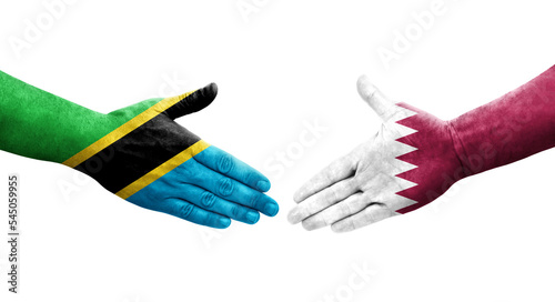 Handshake between Qatar and Tanzania flags painted on hands, isolated transparent image.