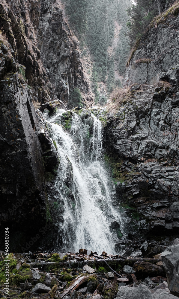 Obraz premium Mountain waterfall of the Zailiysky Alatau mountains Bear Gorge Almaty Kazakhstan