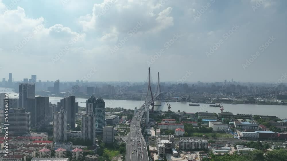 Drone flying above the city traffic and bridge. Drone aerial view. Yangpu bridge and the city highway in the downtown area Shanghai China. Transportation cityscape business concept b-roll footage. Drone flying above the city traffic and bridge. Drone aerial view. Yangpu bridge and the city highway in the downtown area Shanghai China. Transportation cityscape business concept b-roll footage.