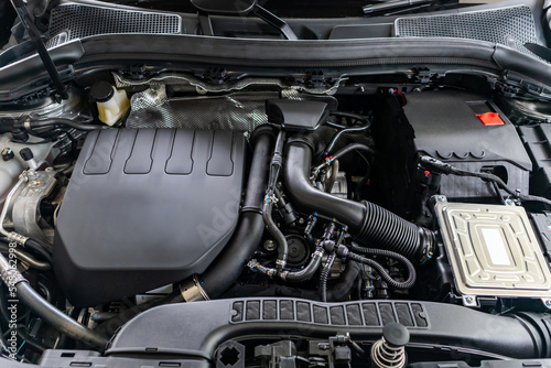 modern car engine under hood close up detail