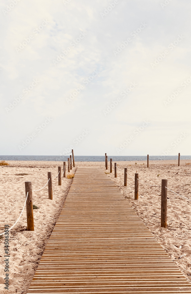 Wooden path with the beach with the sea in the background.summer beach concept.