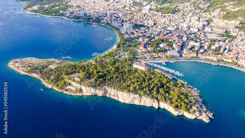 Town of Breal beach and Biokovo mountain aerial panoramic view, Makarska riviera in Dalmatia, Croatia