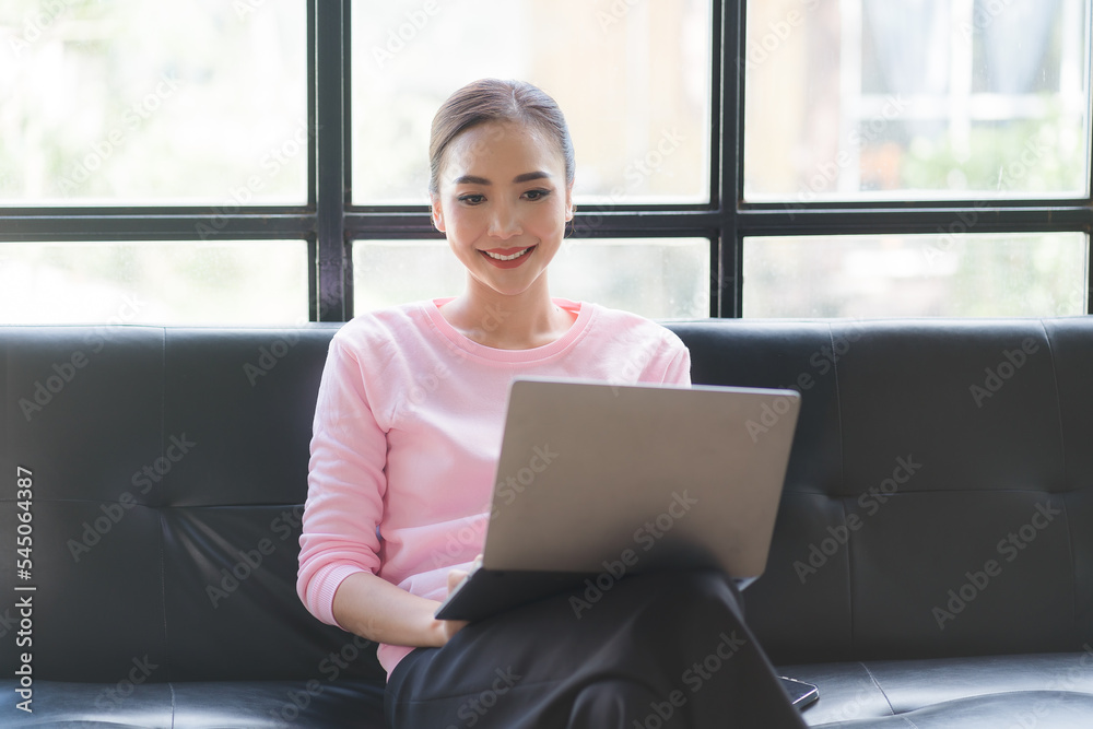 Closeup asian woman holding gold credit card and smartphone, sitting at home, happy satisfied young female customer shopping online, purchasing, making secure online payment. Closeup asian woman holding gold credit card and smartphone, sitting at home, happy satisfied young female customer shopping online, purchasing, making secure online payment.