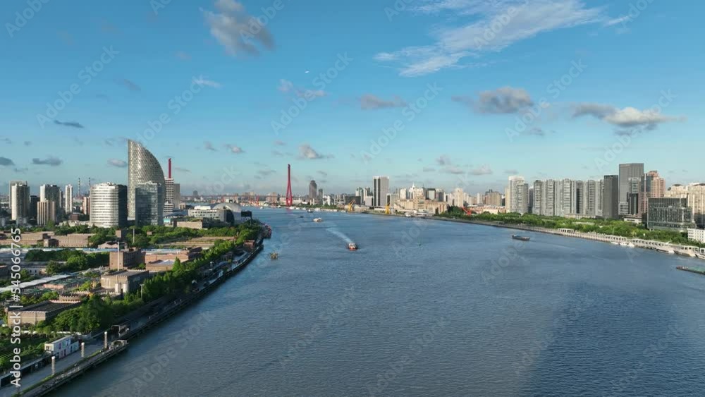 The Huangpu river and city skyline of Shanghai . Drone aerial view. Clear sky and blue river in sunny day during hour in Shanghai China. Cityscape, business, economy concept b-roll footage. The Huangpu river and city skyline of Shanghai . Drone aerial view. Clear sky and blue river in sunny day during hour in Shanghai China. Cityscape, business, economy concept b-roll footage.