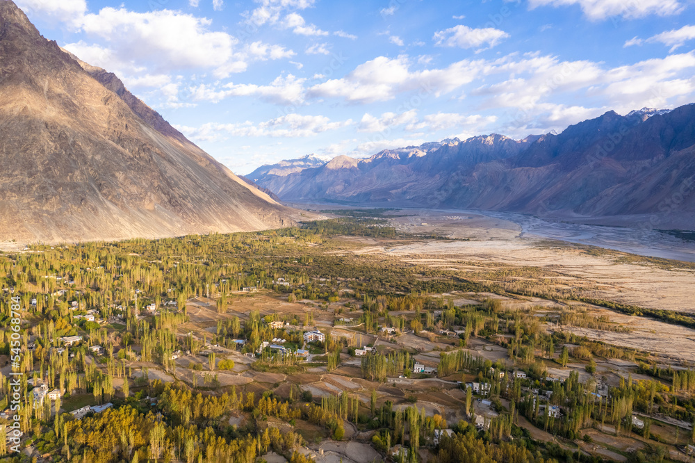 aerial view of Hunder village in Himalayas in the morning, background in Nubra Valley, Ladakh, India.