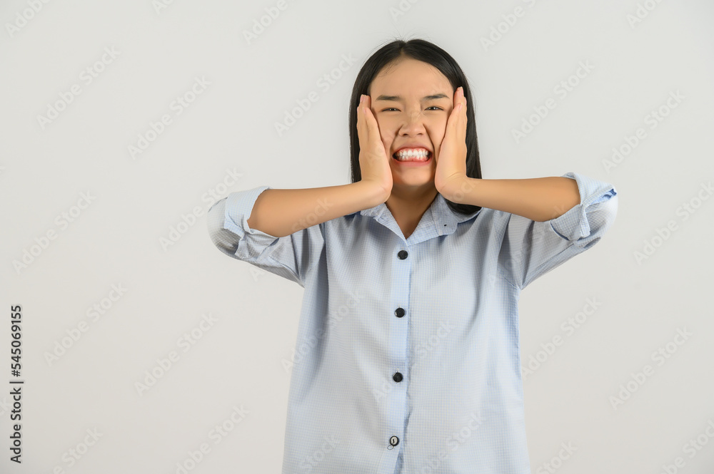 Portrait of Attractive shocked young asian woman in blue shirt isolated on white background Portrait of Attractive shocked young asian woman in blue shirt isolated on white background