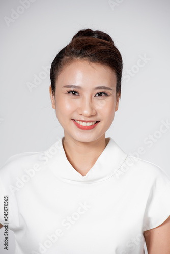 Young Woman Leaning Against white Background