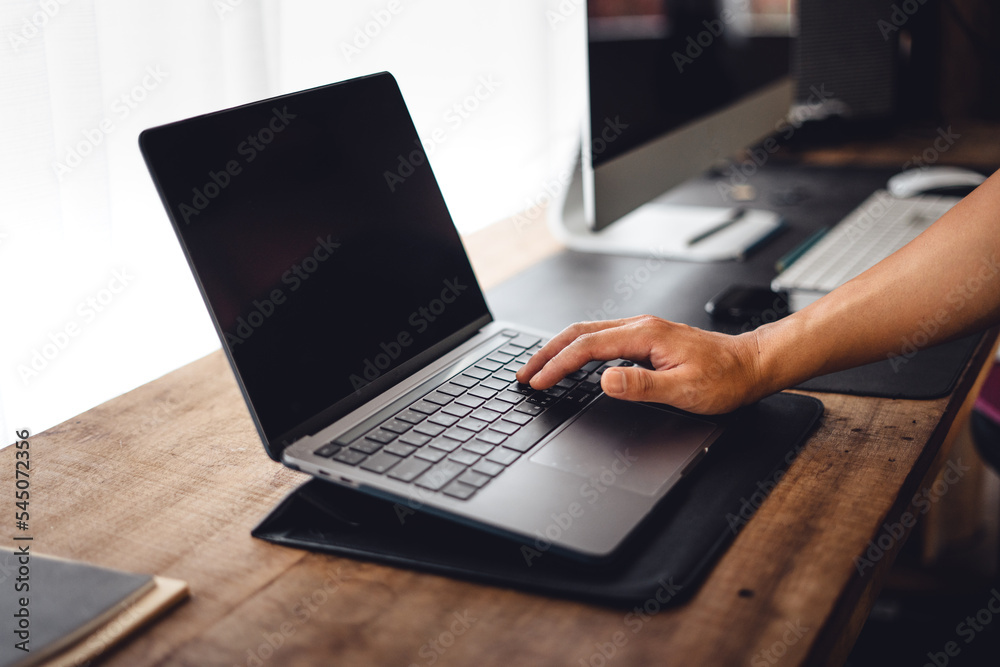 Close up of businessman working and login on laptop Close up of businessman working and login on laptop