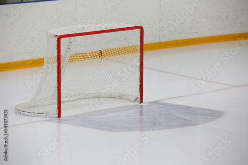 Empty ice hockey goal in ice hall