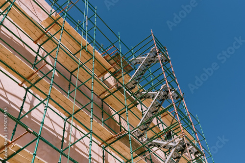  looking up a green scaffolding 