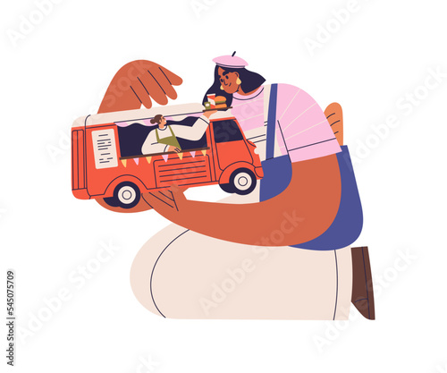 Truck and street food concept. Client ordering fastfood in outdoor trailer. W...