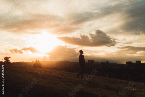 silhouette of a man walking 