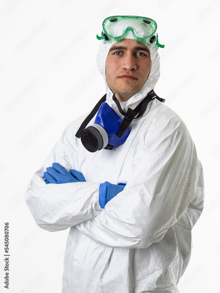 Doctor wearing protective biological suit and mask due to coronavirus 2019-nCoV global pandemic warning and danger background against white background. Doctor wearing protective biological suit and mask due to coronavirus 2019-nCoV global pandemic warning and danger background against white background.