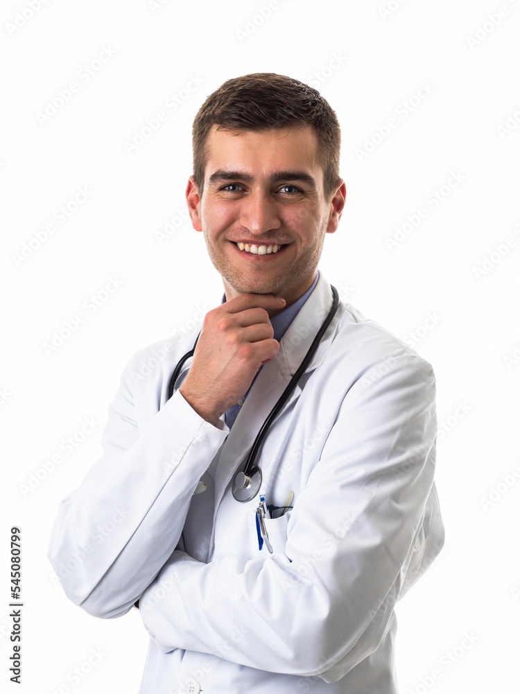 Portrait of hero in white coat. Cheerful smiling young doctor with stethoscope in medical hospital standing against white background. Coronavirus covid-19 danger alert