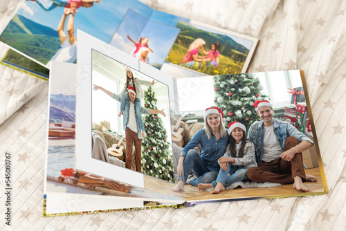 christmas and young family in retro photo book