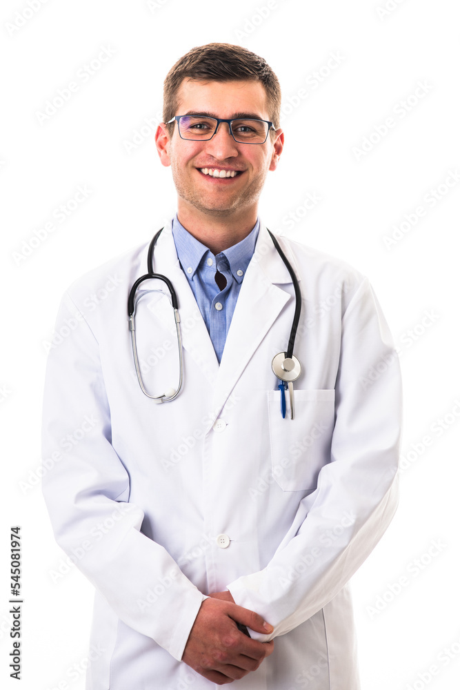Portrait of hero in white coat. Cheerful smiling young doctor with stethoscope in medical hospital standing against white background. Coronavirus covid-19 danger alert Portrait of hero in white coat. Cheerful smiling young doctor with stethoscope in medical hospital standing against white background. Coronavirus covid-19 danger alert