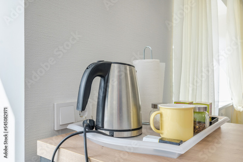 kitchenware and household utensils on kitchen shelves