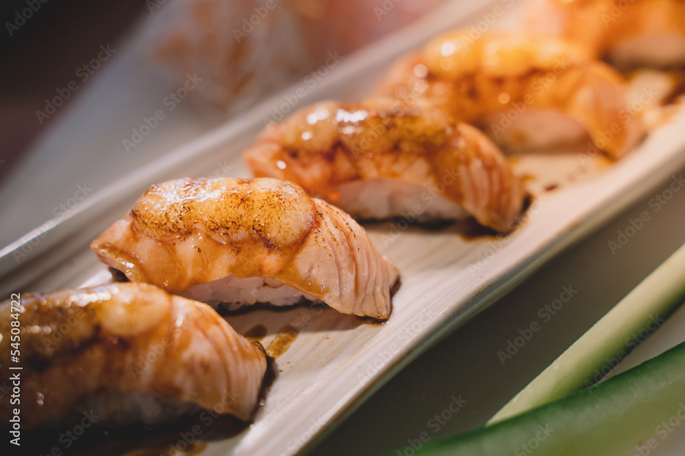 Salmon sushi is a popular fish dish. sushi is a street food of japan and new business in the world. Salmon sushi is a popular fish dish. sushi is a street food of japan and new business in the world.