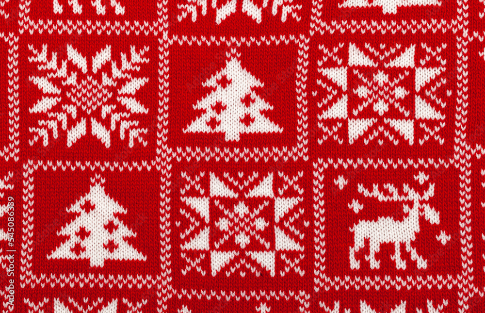 Red knitted fabric with white traditional cristmas geometric ornament Red knitted fabric with white traditional cristmas geometric ornament