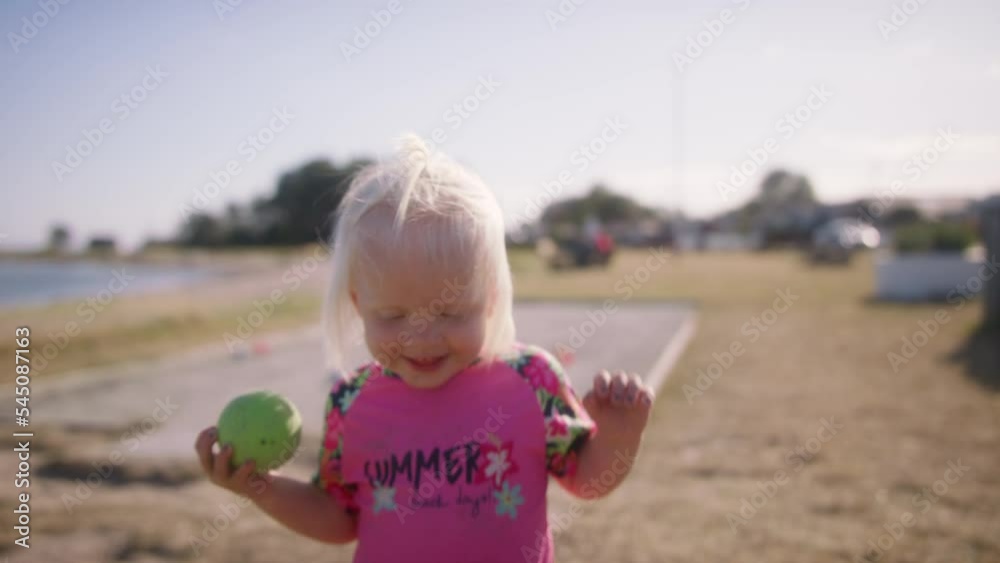 Little Girl Smiling And Walking Towards The Camera Little Girl Smiling And Walking Towards The Camera