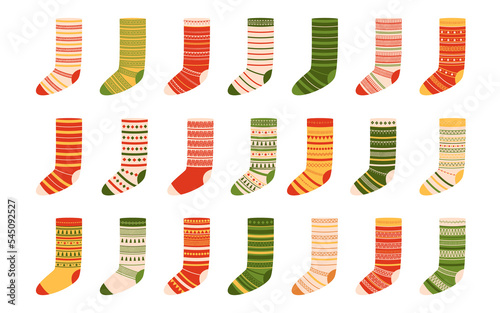 Collection of woolen christmas socks with different ornaments. Illustration on transparent background
