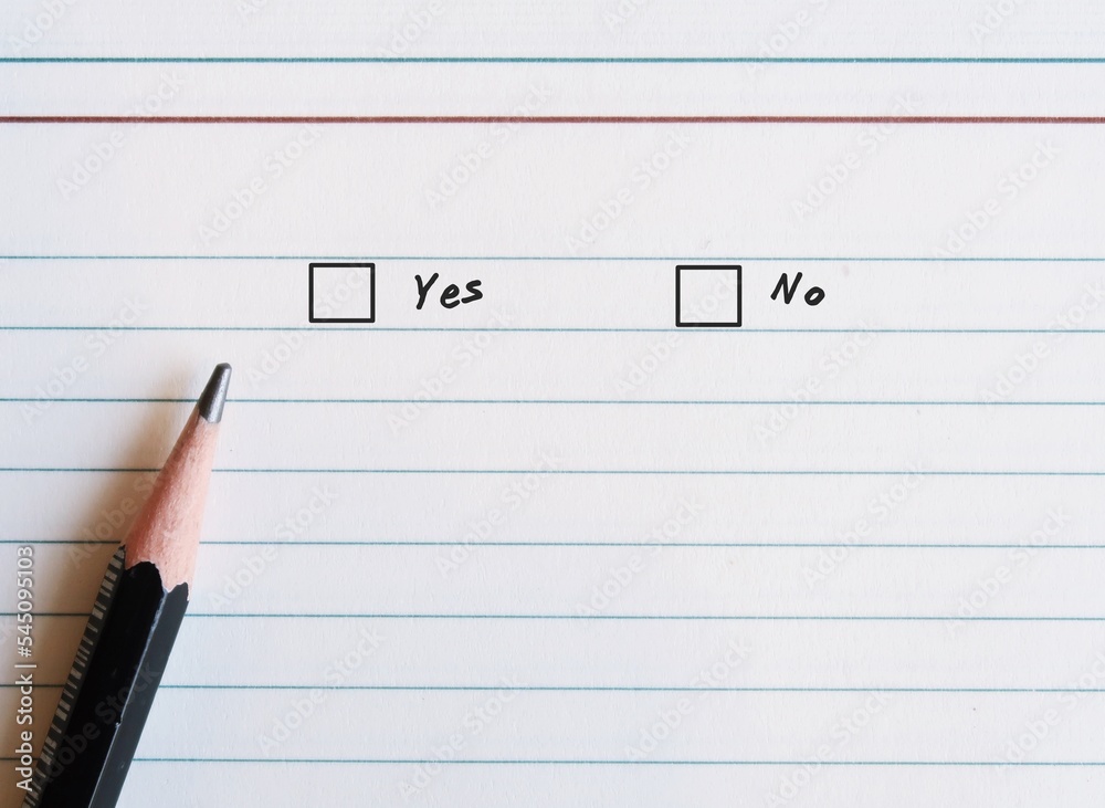 Paper notebook sheet and pencil , with two choices checklists to choose between YES and NO - Concept of decision making to say yes or no, stop being people pleaser with courage to say no Paper notebook sheet and pencil , with two choices checklists to choose between YES and NO - Concept of decision making to say yes or no, stop being people pleaser with courage to say no