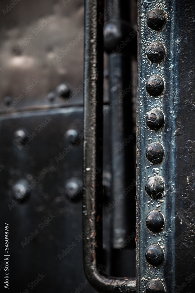 Details of old metal train cars and locomotives.