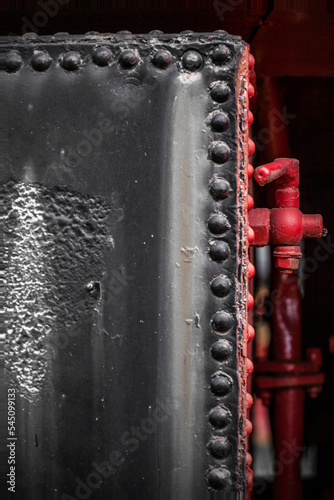 Details of old metal train cars and locomotives. photo