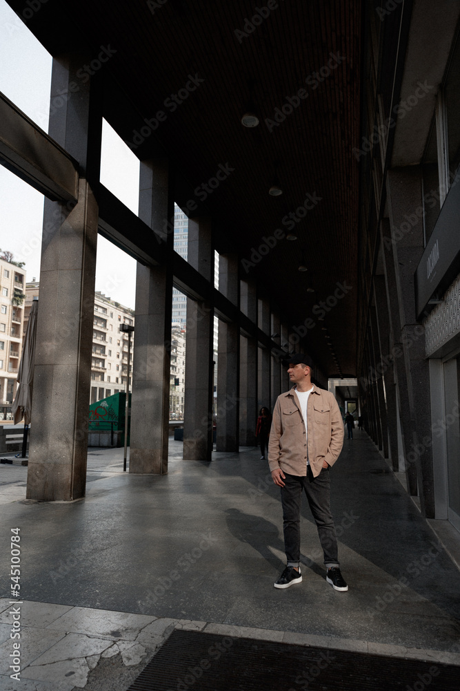 A hipster discovers and walks the streets of Milan. Spring and autumn holidays in Italy. A hipster discovers and walks the streets of Milan. Spring and autumn holidays in Italy.