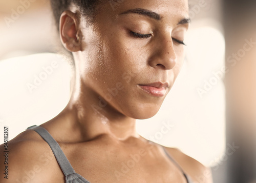 Woman, tired face and sweating in gym workout, training or exercise for body goals, heart health or cardio wellness. Zoom, exhausted or fatigue sports athlete, fitness coach or personal trainer break